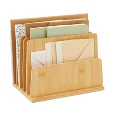 a bamboo desk organizer holds several folders