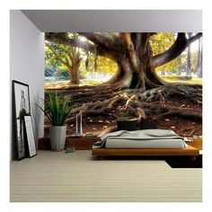 a bedroom with a large tree in the middle and sunlight coming through it's branches