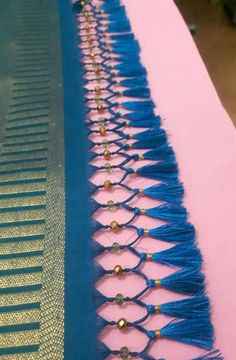 the table is covered with blue and gold tassels