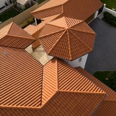 an aerial view of a house with orange roof tiles