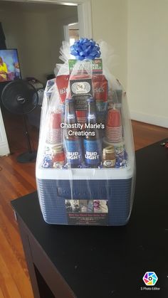 a plastic container filled with drinks on top of a table