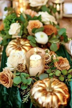 a long table with candles and flowers on it