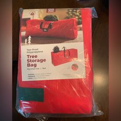 the red bag is packed and ready to be used as a storage bag for christmas gifts