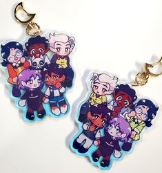 two key chains with cartoon characters on them