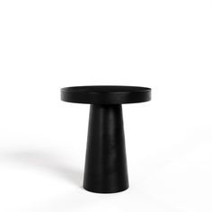 a black round table on a white background