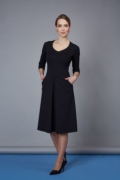 This black casual dress has pockets and a fold in the center of the skirt. The reliefs and seam at the waist have decorative stitches. There's an elegant and comfortable work dress.  The size table is in the PICTURES. The fabric is stretchy.  To choose a size, please, compare your BUST measurement with the same measurement in the size table.  After that, please match your other shape measurements with table dimensions. Dress length ~  108 cm  / 44"  Sleeves length ~ 45 cm / 18" FABRIC: Fabric: - Women Business Dress, Black Casual Dresses, Business Dress Women, Midi Dress Work, Decorative Stitches, Women Business, Business Dress, Black Casual Dress, Work Dress