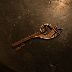 an old key is laying on the table