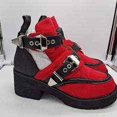 2.5 Inch Heels. Neoprene With Black Leather Straps And Accents. Red Platform Boots For Streetwear, Red Punk Platform Boots, Fall Red High-top Moto Boots, Red High-top Moto Boots, Red High-top Moto Boots For Fall, Trendy Red Boots For Streetwear, Red Boots For Fall Streetwear, Edgy Red Leather Boots, Shoe References