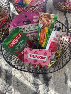 a basket filled with snacks and candy on top of a table