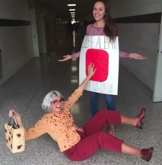 two women dressed in costume posing for the camera with a sign on their back that says faith