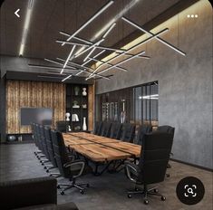 a large conference room with black leather chairs and a wooden table in front of it