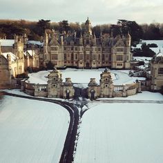 an aerial view of a castle in the snow