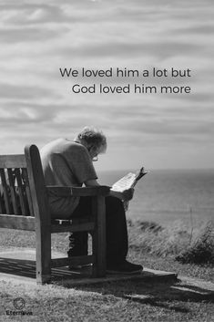 an old man sitting on a bench reading a book with the ocean in the background