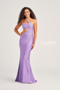 a woman wearing a purple gown with one shoulder and cut out at the top, posing for