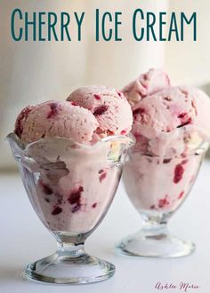 two glasses filled with ice cream sitting on top of a table