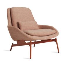 an upholstered lounge chair with wooden legs