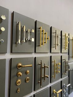 a wall with many different types of door handles and knobs on the side of it