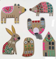 wooden cut outs with animals and houses on them