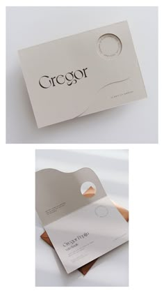 two different business cards, one with a circular logo on the front and one with a circle