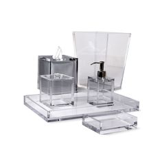 three pieces of clear acrylic with soap dispenser and toothbrush holder