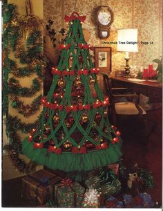 a green christmas tree with red bows and lights