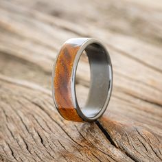 a wedding ring with wood inlays the center