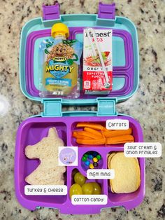 a purple lunch box filled with lots of food