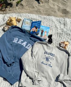 Introducing your new summer essential This slate blue sweatshirt is Independent Trading Co. brand and unisex sizing. It features an embroidered applique design, showcasing the word "READ" in a unique, layered seashell fabric. Ll Bean Tote, Coastal Girl, Bookish Merch, Summer Essential, Coastal Chic, Embroidered Applique, Blue Sweatshirt, Comfy Cozy, Slate Blue