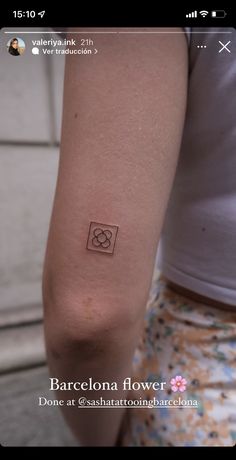 a person with a small tattoo on their arm