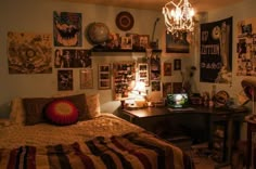 a bedroom with many pictures on the wall