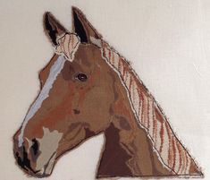 a close up of a horse's head on a piece of cloth with white background