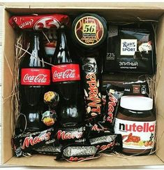 a box filled with lots of different types of food and drinks on top of each other