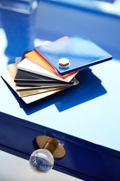 a stack of credit cards sitting on top of a blue table