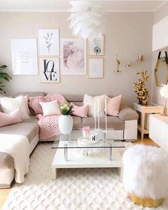 a living room filled with lots of furniture and pictures on the wall above it's coffee table