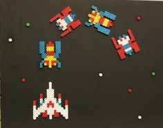 an art piece made out of legos and pieces of other toys on a black background