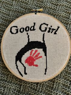 a cross - stitch pattern with the words good girl on it and a hand print