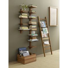 a ladder leaning against a wall next to a book shelf with several books on it