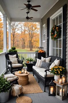 an outdoor porch with wicker furniture and fall decorations