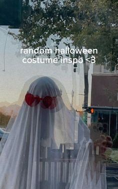 a ghost sitting on top of a white bench in front of a window with the words random halloween costume inspo 3