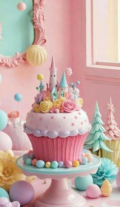 a cupcake decorated with pink frosting and pastel blue icing is on a cake stand