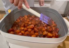 a person is stirring some food in a pot