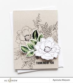 a close up of a card with flowers on it