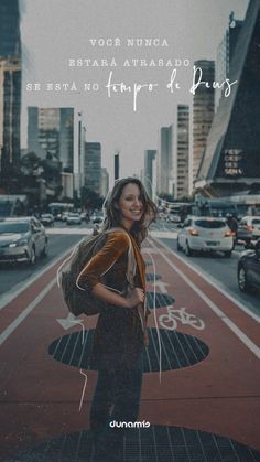 a woman standing in front of a city street