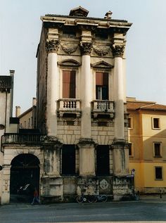 an old building with many windows and balconies