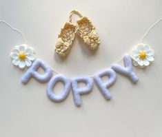 "This daisy felt name garland is a great way to add a personal touch to a little person's bedroom or nursery. Each letter is about 3 inches(8 cm) tall. The letters are strung on a strong white cotton thread. Please select the number of letters in the name from the drop-down menu. Also, it will include two daisies. In the \"Note to seller\" please write the name and colors . You can see the palette of felt in the last photo. Felt name garland is 100% handmade and created from high-quality wool fe Felt Name Garland, Daisy Name, Felt Daisy, Felt Dog Ornament, Garland Nursery Decor, Baby Name Banners, Mobile Diy, Name Garland, Felt Bunting