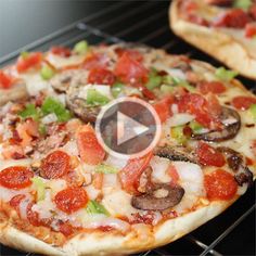 two pizzas sitting on top of an oven rack covered in pepperoni and mushrooms