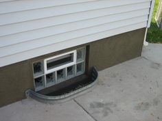 an open window on the side of a house