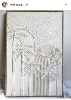 an art piece with palm trees on it