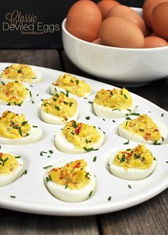 deviled eggs are arranged on a white plate