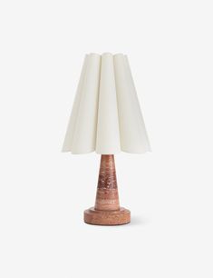 a table lamp with a white shade on it's base and a brown base